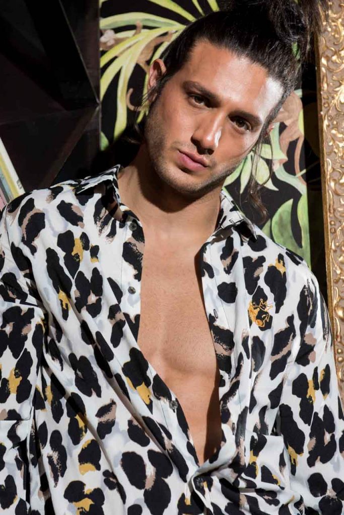 A model with a mottled shirt
