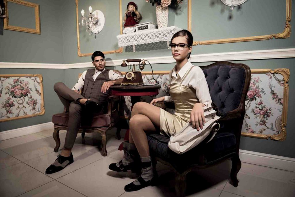 Models in fashionable style are sitting